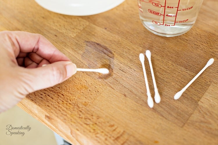 Use a Qtip to apply hydrogen peroxide to stain Use a Qtip to apply hydrogen peroxide to stain