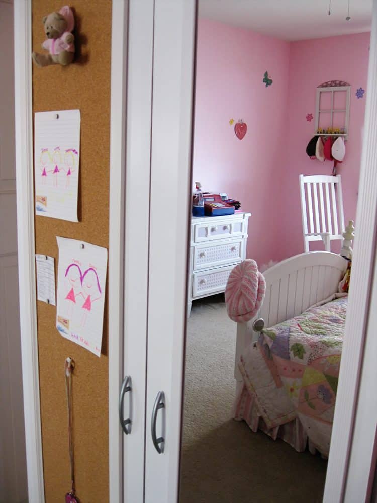 Ikea wardrobe updated with paint, molding, mirror and corkboard