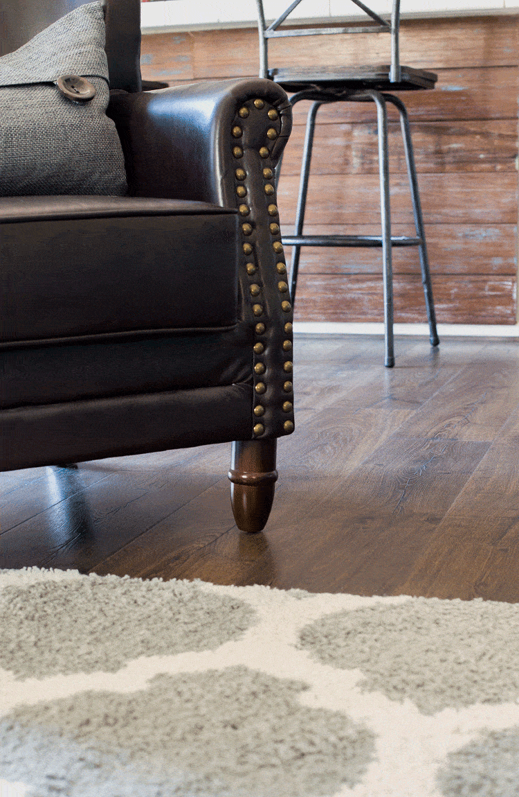 leather-chair-and-bar-stools-with-new-pergo-outlast-flooring