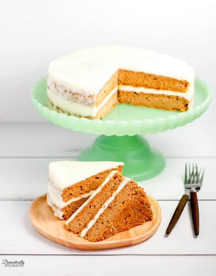 Carrot Spice Cake made with Greek Yogurt for a healthier option. Carrot Spice cake on a green cake stand