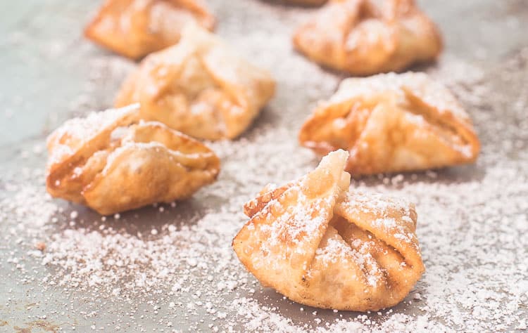 Apple Pie Wontons with cinnamon sugar and powdered sugar Apple Pie Wontons with cinnamon sugar and powdered sugar