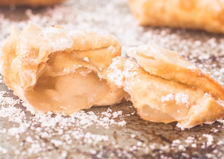 Apple Pie Wontons with cinnamon sugar and powdered sugar Warm apple filling inside wonton
