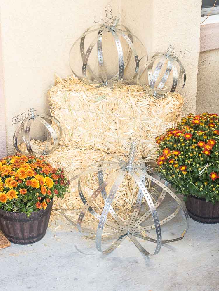 Rustic Industrial Autumn Porch with a Large Wood and Metal Lantern, Leaf Wreath, DIY Metal Pumpkins, Gather Doormat and lots of Fall Mums