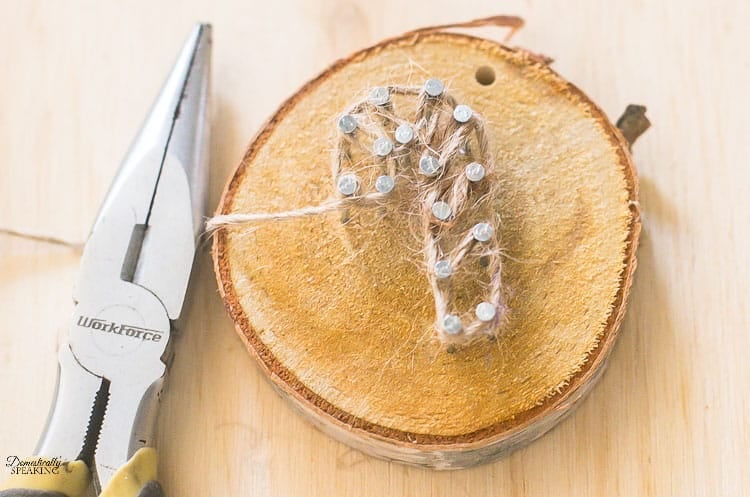 Rustic Twine and Wood Slice Christmas Ornament twine around nails