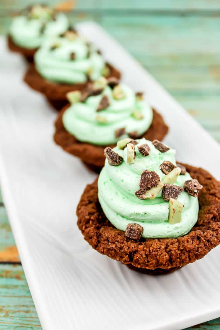 Andes Mint Chocolate Cookie Cups are an easy baked treat that is packed with that chocolate and mint that you love! These bite sized desserts are perfect for St. Patrick's Day, showers, birthdays or anytime. Andes Mint Chocolate Cookie Cups are an easy baked treat that is packed with that chocolate and mint that you love! These bite sized desserts are perfect for St. Patrick's Day, showers, birthdays or anytime.