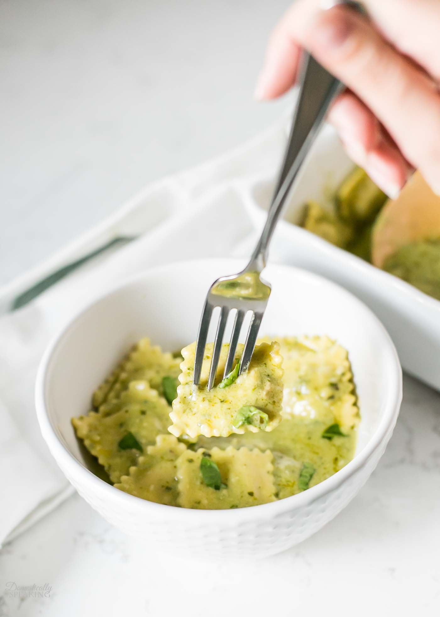 Baked Ravioli with Pesto Creamy Sauce Domestically Speaking