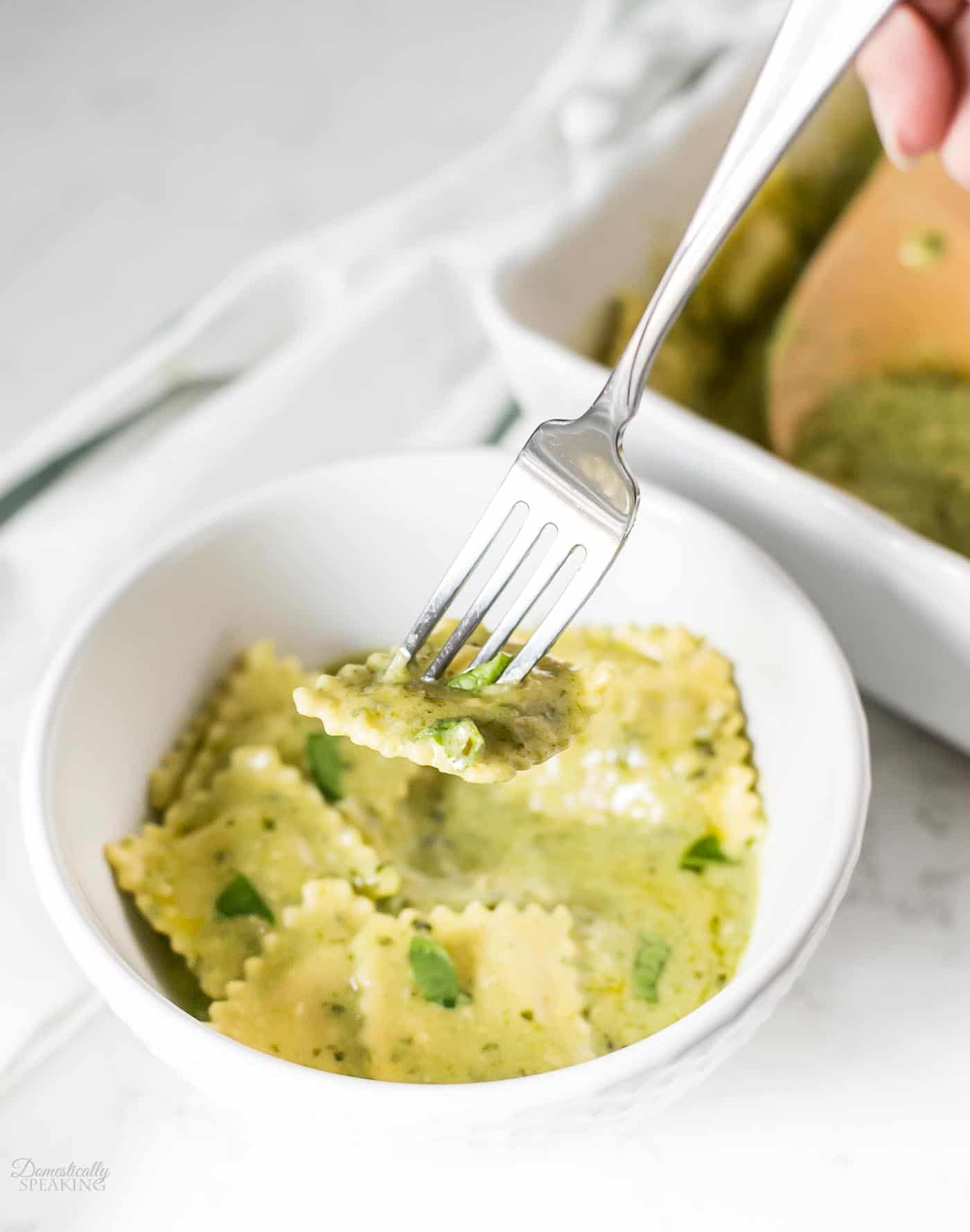 Baked Ravioli with Pesto Cream Sauce is a great one pan dinner recipe! Baked Ravioli with Pesto Cream Sauce is a great one pan dinner recipe!