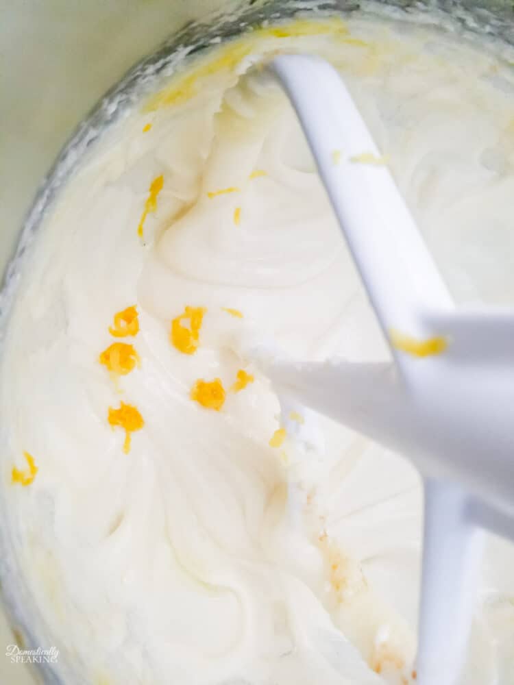Adding the lemon zest to the lemon cream cheese batter.