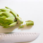 cutting stem off artichoke