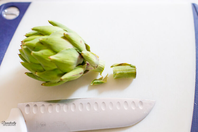 cutting stem off artichoke