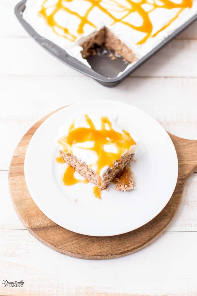 Caramel apple poke cake topped with sweet caramel flavor