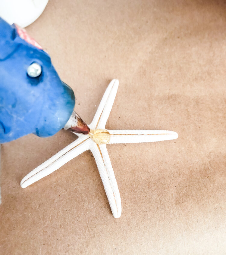 adding hot glue to starfish
