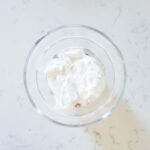 add marshmallow whipped topping to the top of the chocolate pudding