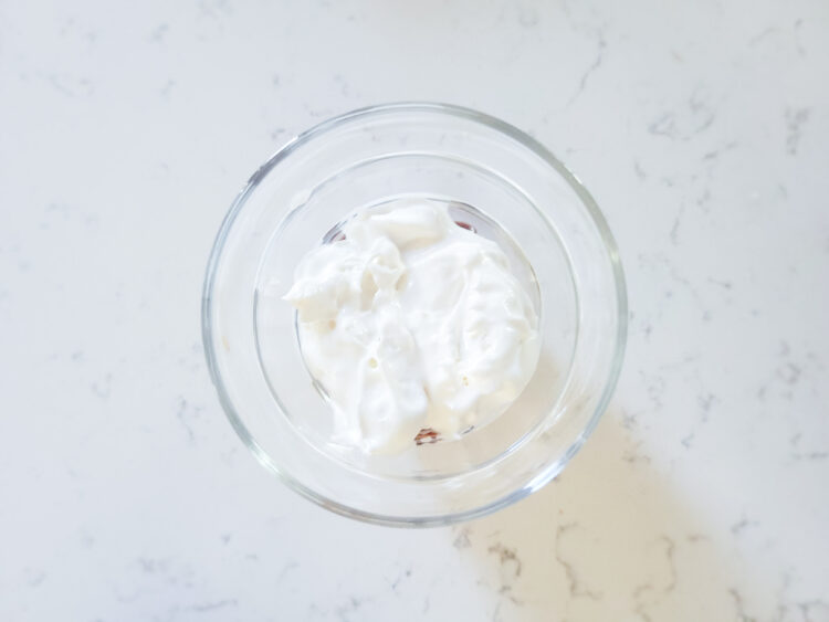 add marshmallow whipped topping to the top of the chocolate pudding