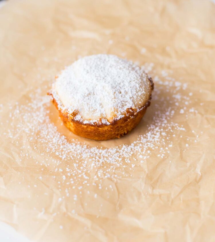 a single lime impossible pie with powdered sugar on top