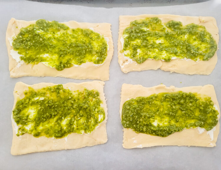 pesto spread on top of cream cheese for chicken pinwheels