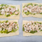 adding cooked chicken to the pinwheel crescent dough