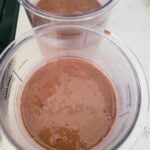 pour chocolate ice cream mixture into ninja creami containers
