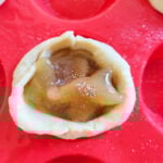 add apple pie filling into crescent roll cup