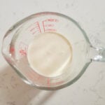 wet ingredients of heavy cream, egg, and vanilla bean paste