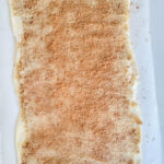 spread brown sugar and cinnamon over the buttered crescent rolls